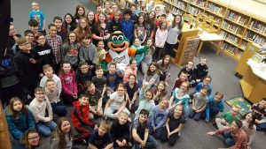 Ribbi from the Eastside Diamond Hoppers visits students at Naldtrett Elementary in Anchor Bay.