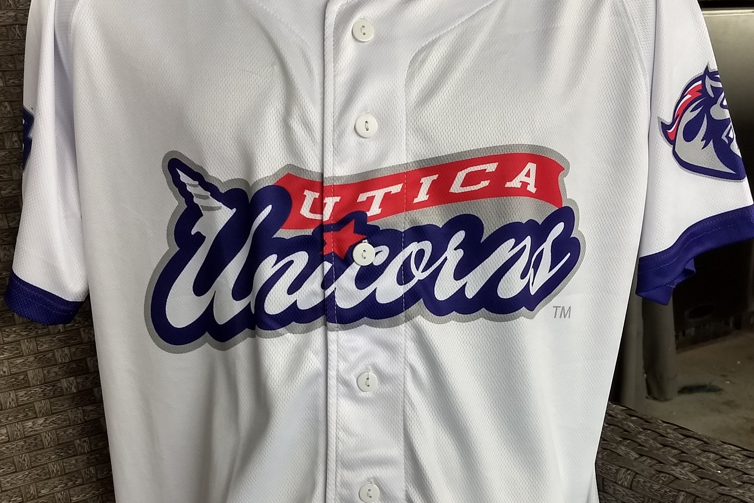 Utica Unicorns full button-up replica jersey closeup of team name wordmark on front