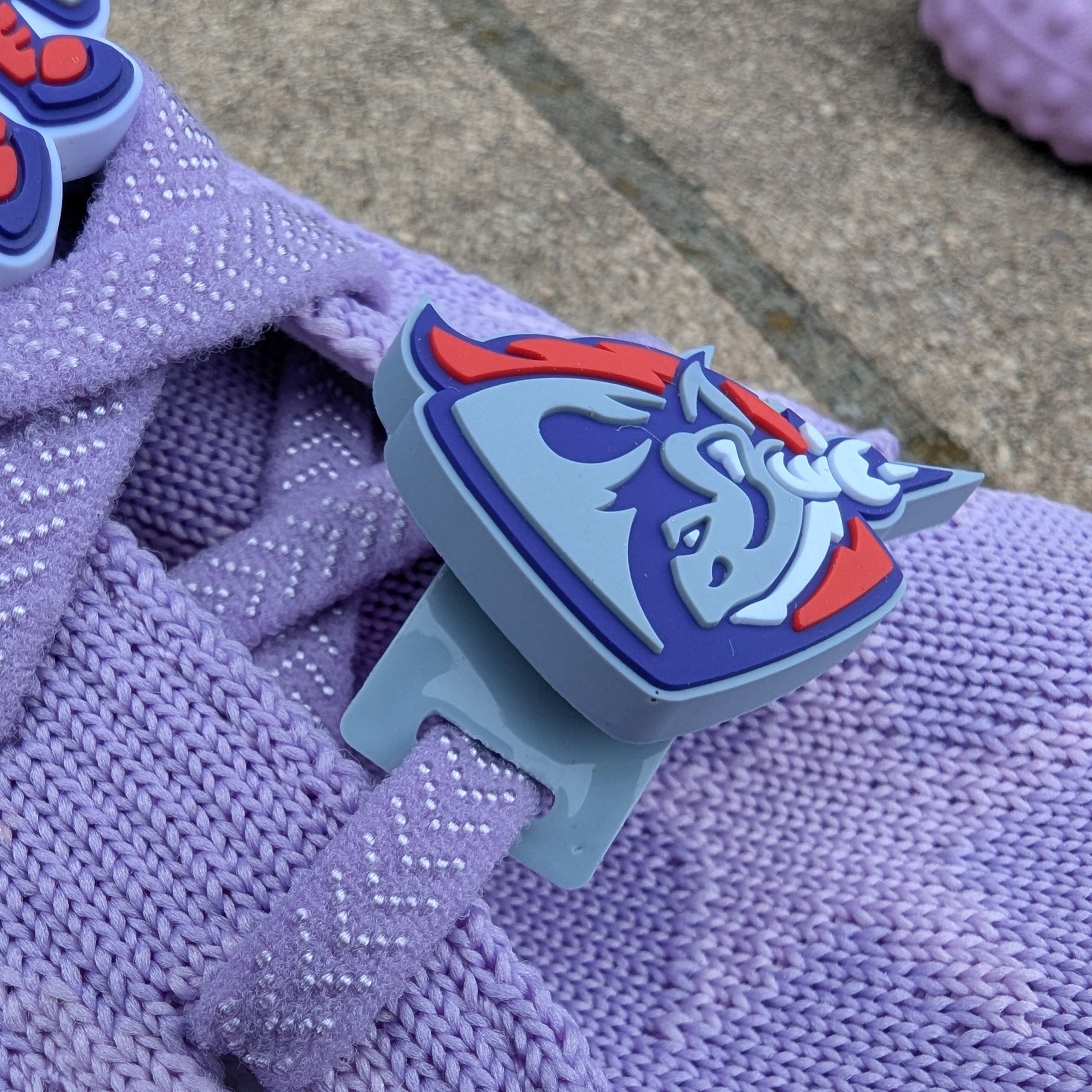 close up of Unicorns shoe charm showing shoe lace attachment